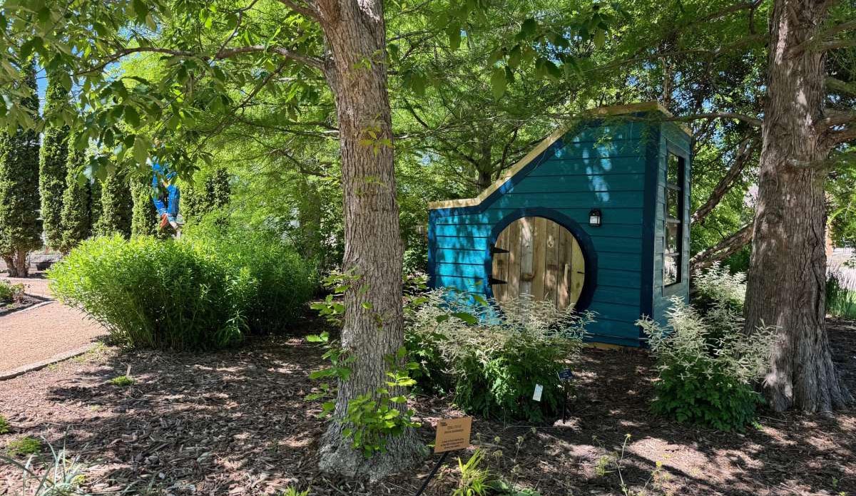 A tiny house exhibit in Reiman Gardens.