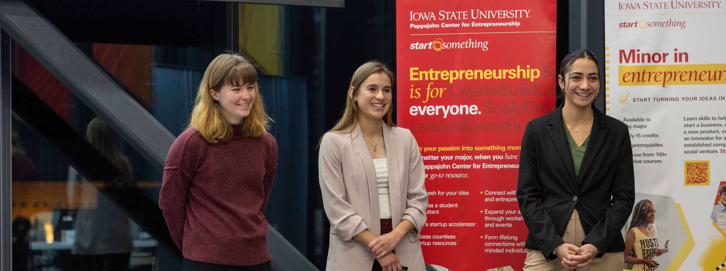Three students presenting a project to class